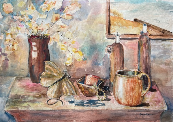 Watercolor painting A woodeen table with brown vase of white and pink flowers moth brown bowl of pearls a light brown mug with handle facing to the right two tall brown candle holders with thin white candles unlit Lower left corner of a painting of