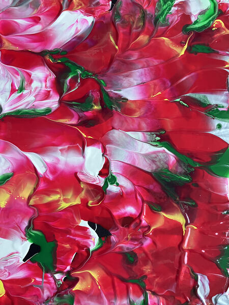Bright strokes of a reddish pink paint with green threaded throughout ultimately creating a feeling of a canvas full of fallen flower petals 