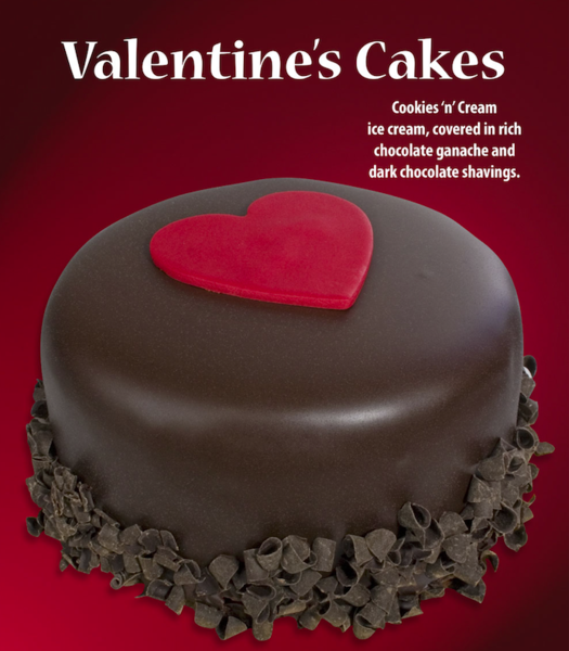 Valentines Cakes cookies n cream ice cream covered in rich chocolate ganache and dark chocolate shavings with photo of chocolate covered cake with red heart on center of top of cake and chocolate shavings along base